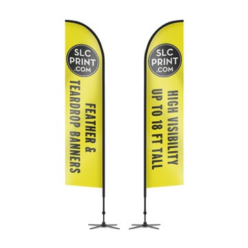 A picture of some vertical feather banners with cross base floor stands. Used to gather attention by drivers passing by.